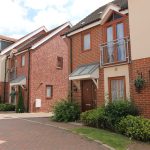 Modern brick houses with driveways