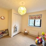 Child's room with toys and closet.