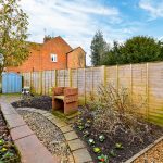 Small garden with shed and flower bed