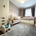 Cosy children's bedroom with toys and daylight.