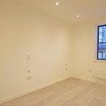 Empty room with wooden floor and window