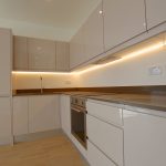 Modern kitchen with integrated appliances and lighting