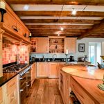 Rustic kitchen with wooden cabinets and island