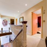 Modern hallway with artwork and open doors