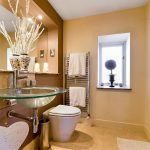 Modern bathroom with glass sink and elegant decor