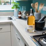 Rapeseed oil bottle in modern kitchen setting