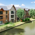 Modern riverside apartments with wooden cladding