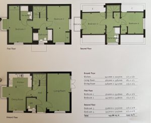 Three-story house floor plan layout with measurements.