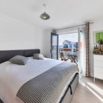 Modern bedroom with balcony view