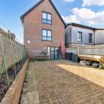 Spacious brick patio in residential outdoor space