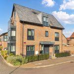 Modern brick house with slate roof on corner