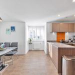 Modern kitchen and dining area with natural light