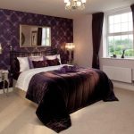 Elegant bedroom with purple accents and décor.