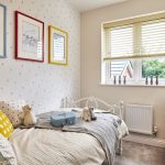 Cosy child’s bedroom with colourful decor and toys.