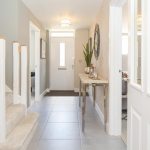 Bright hallway with modern decor and staircase