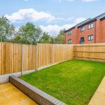 Enclosed garden with lawn and fencing